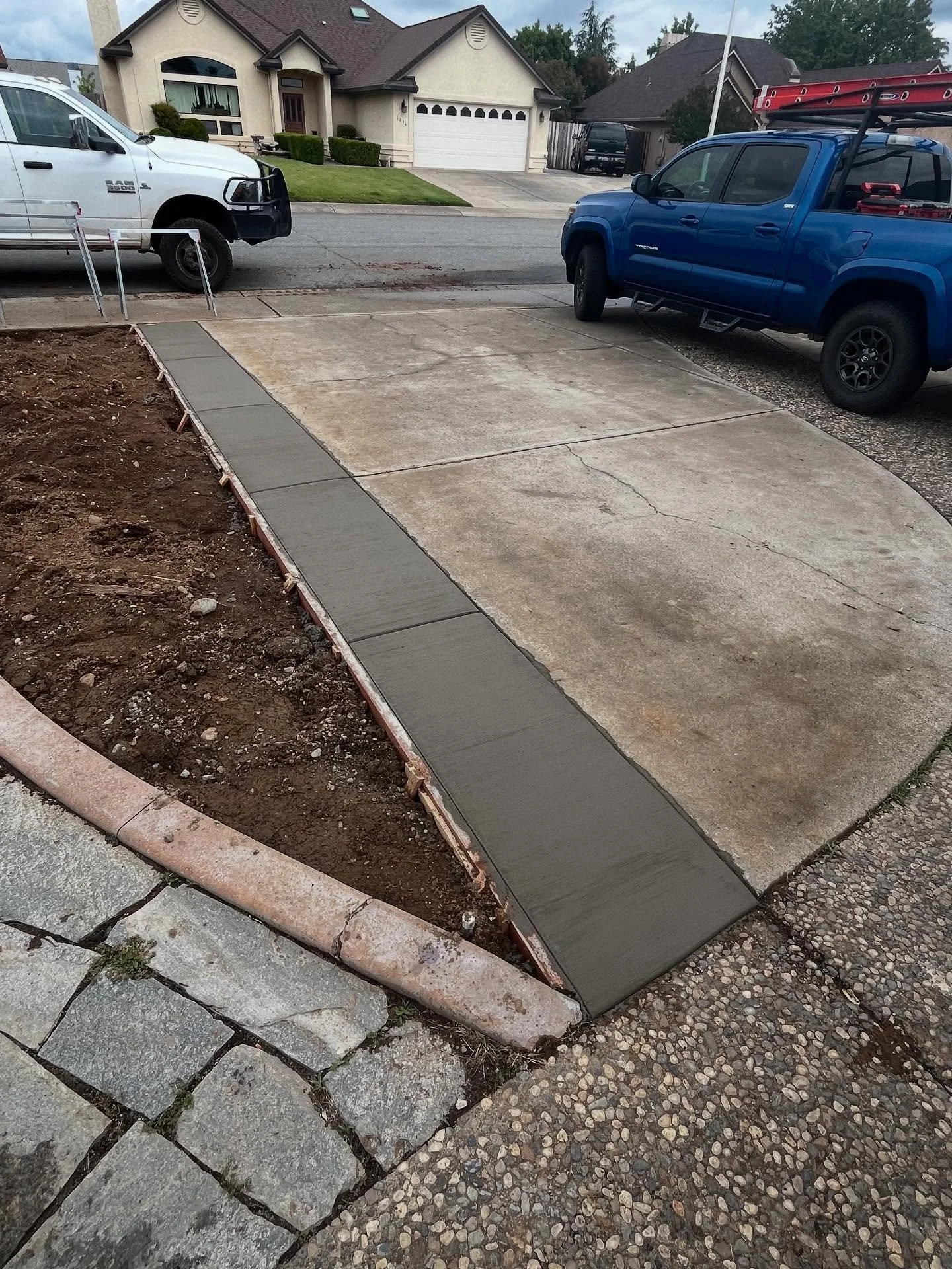 Great day for a little yard work and concrete driveway extension! 👌