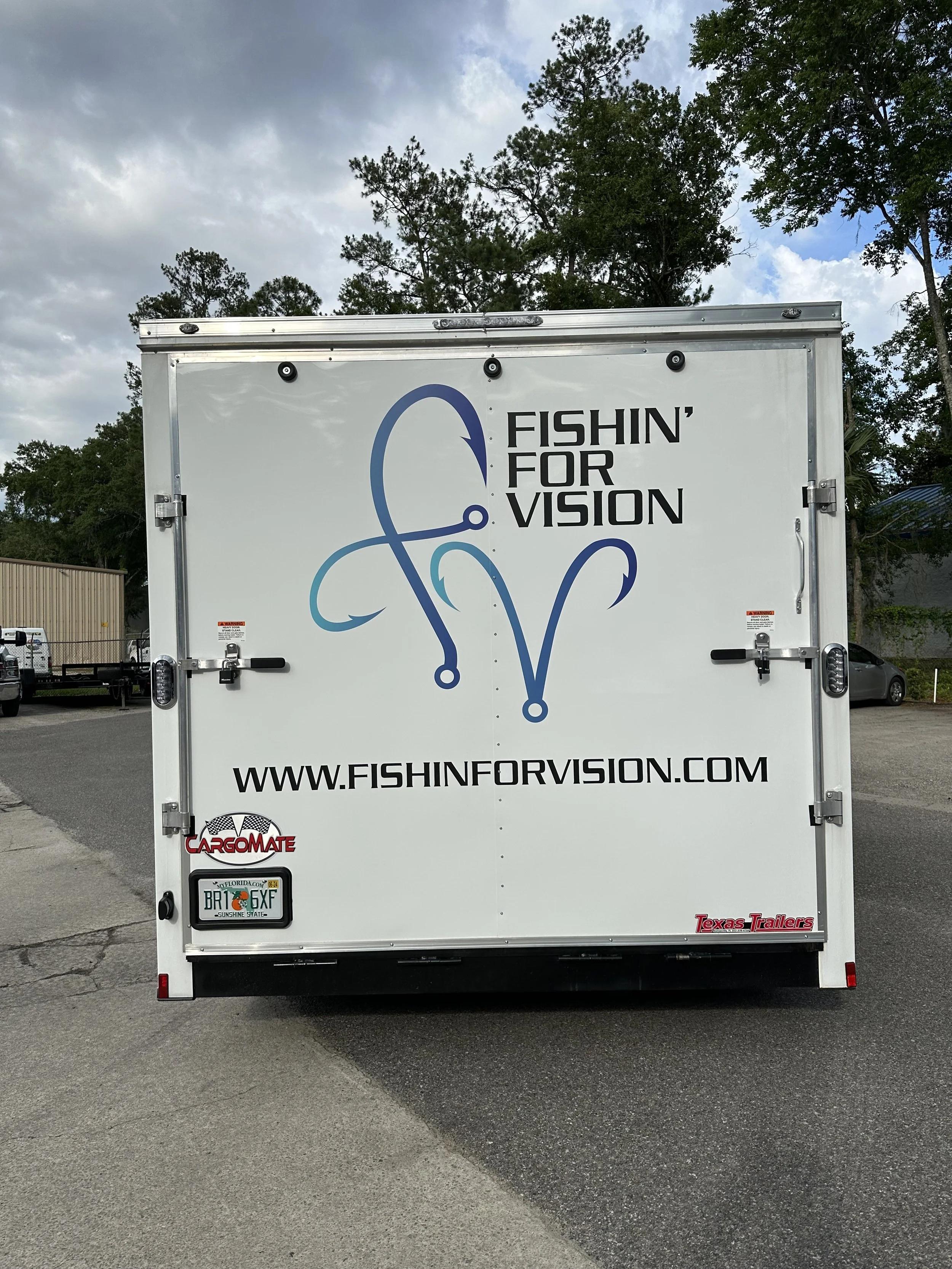Fishing for Vision sign displayed on the back of a trailer”