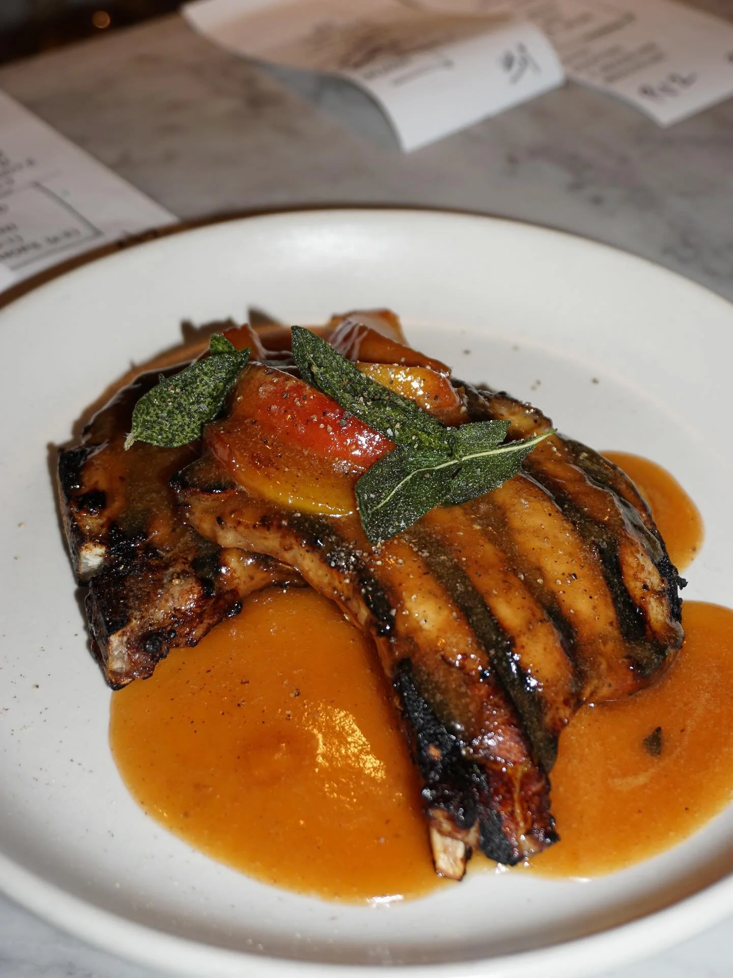 Sharing a few dishes currently featured at Tratto before our menu changes this Thursday&hellip; Thin cut pork chops served with peaches and sage, and a fresh cranberry bean salad with cherry tomatoes, Romano beans and pickled Fresno 🍑🌶️ come and tr