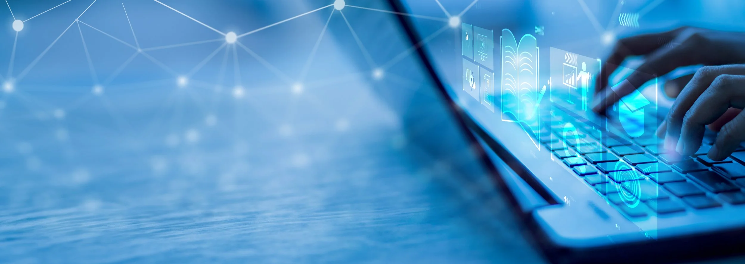 hands typing on laptop keyboard