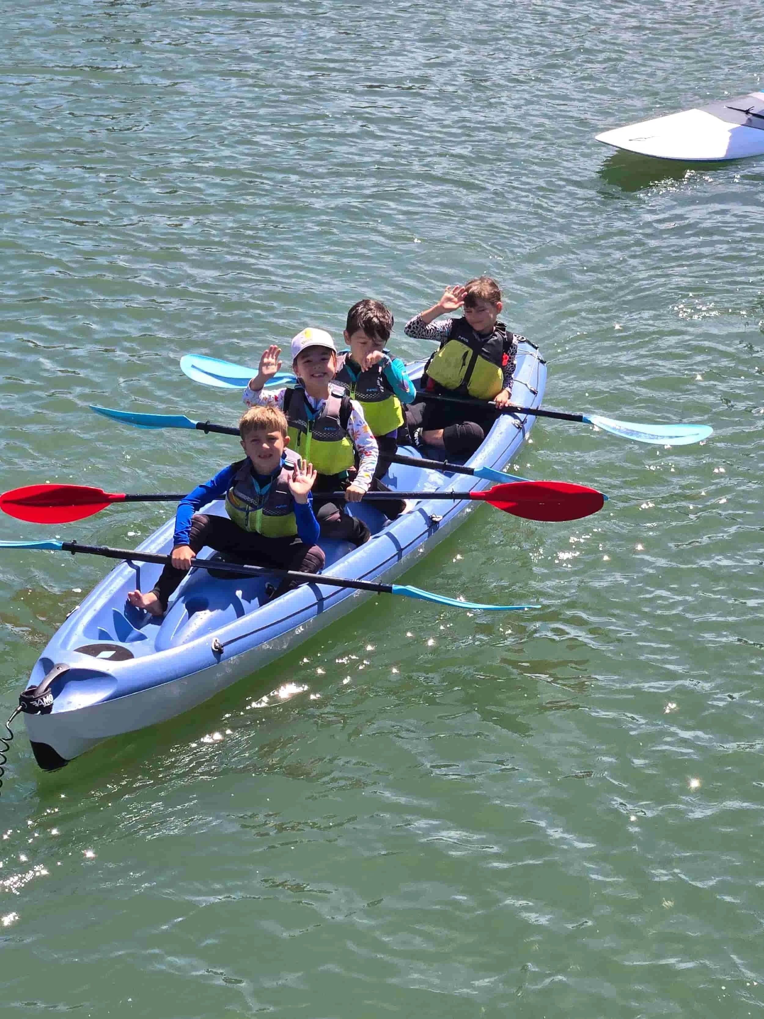 Kids kayaking and having fun for summer camp in the East Bay. 
