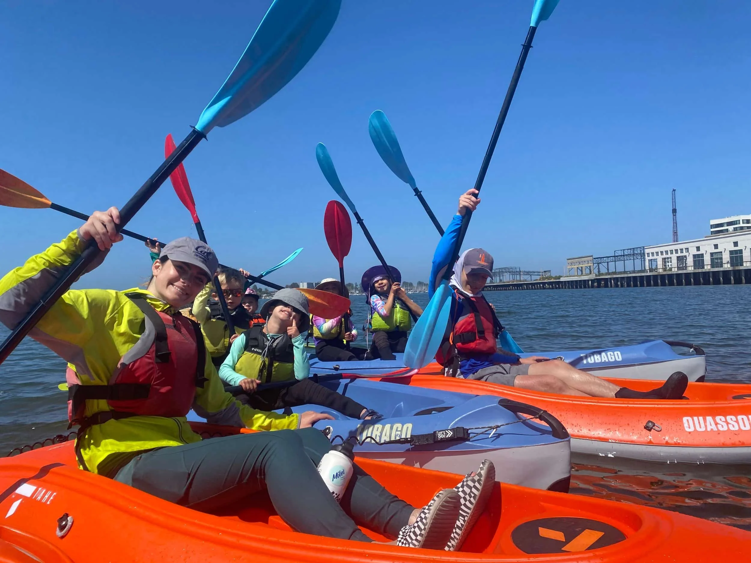 Kids kayaking in Alameda having fun at summer camp.