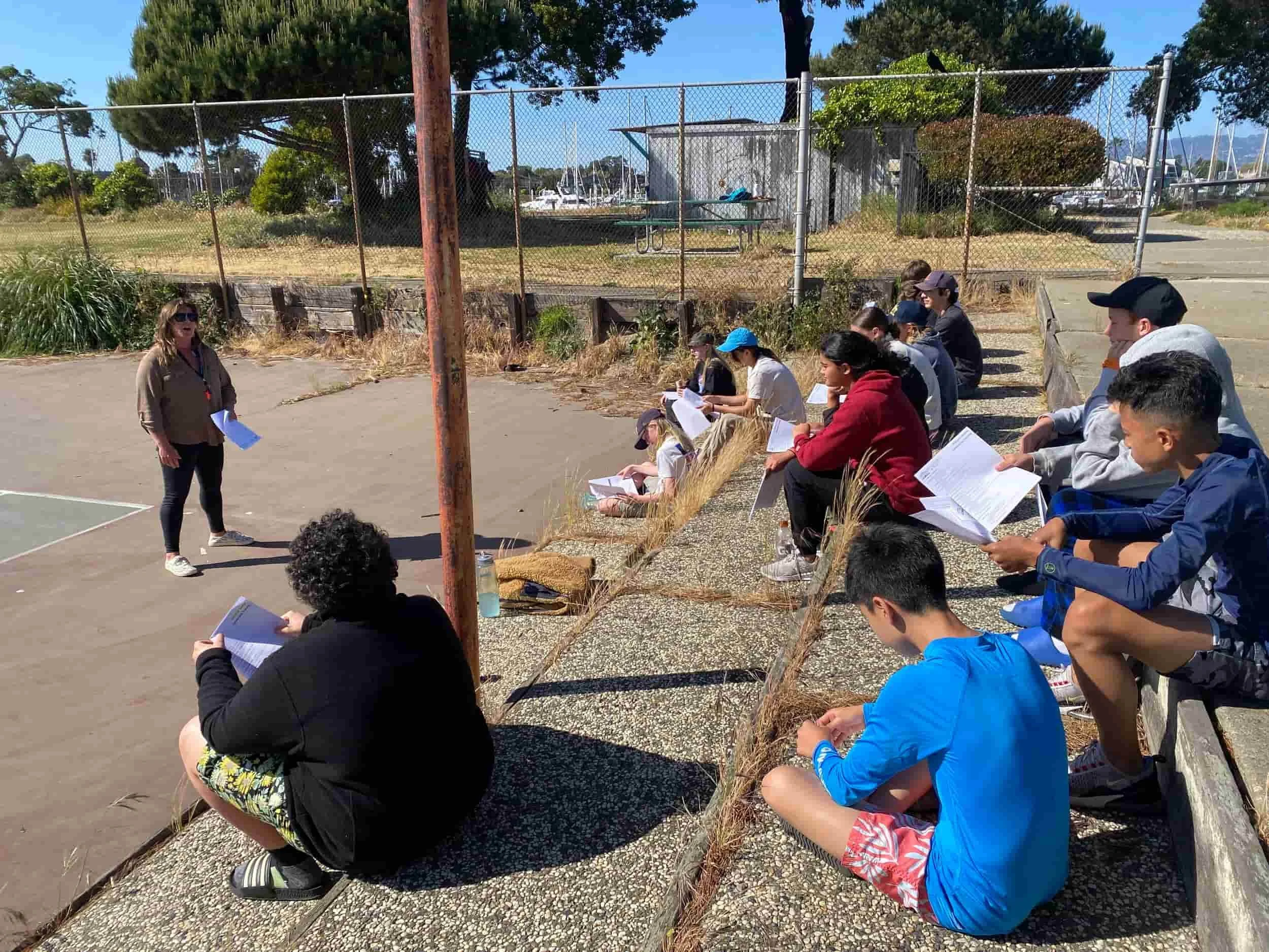 A group of students learning a marina biology lesson at the best summer camp in the Bay Area 