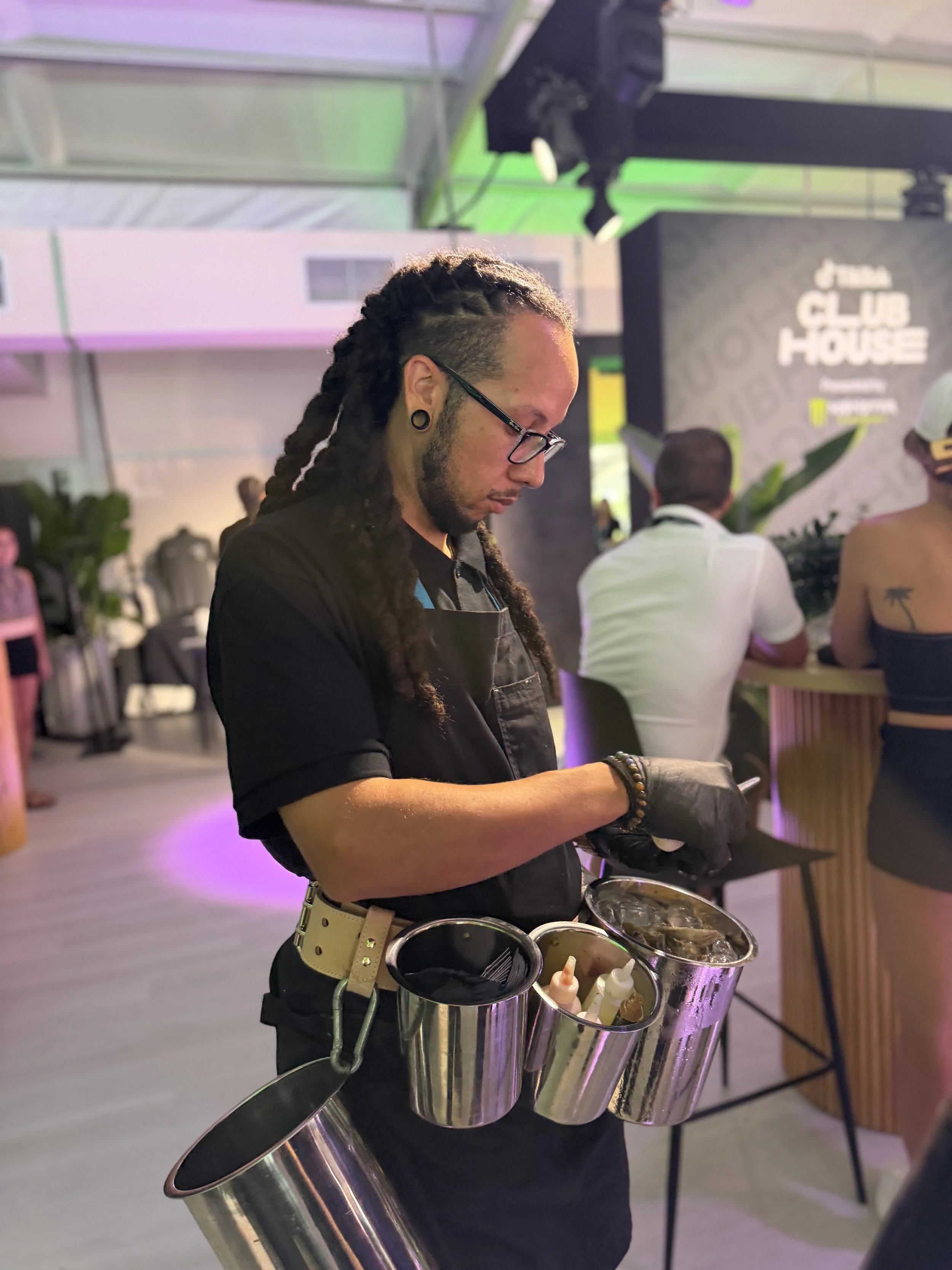 Shucker shucking fresh oysters at the Club House raw bar at the Miami Grand Prix, Formula 1, Miami 2026