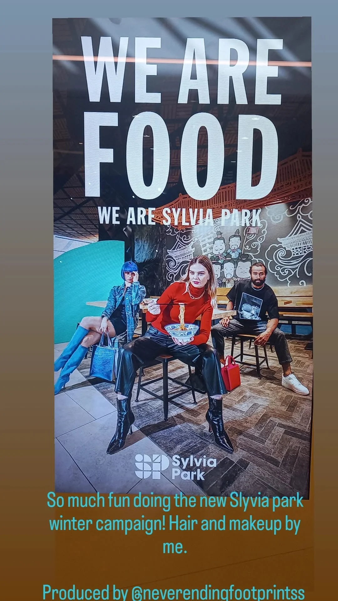 Poster promoting Sylvia Park, featuring three models in trendy clothing and stylish makeup, with large text that reads 'WE ARE FOOD'. Kaz Elizabeth from glamour tribe makeup team