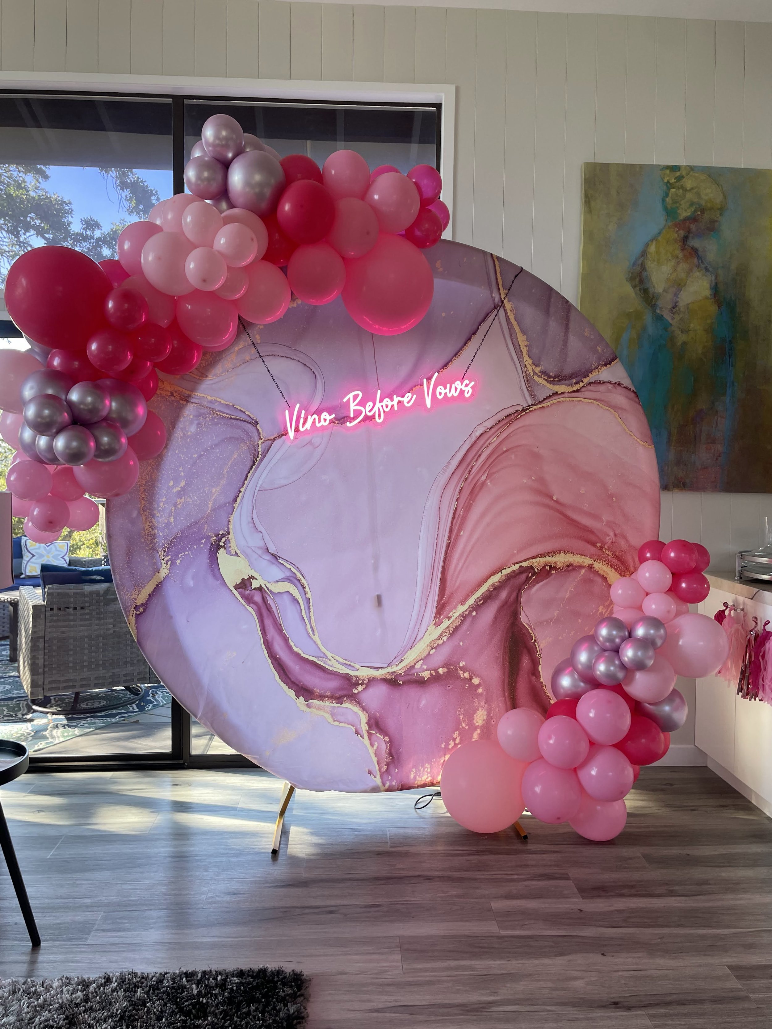 pink colorful Vino Before Vows backdrop for the bachelorette party