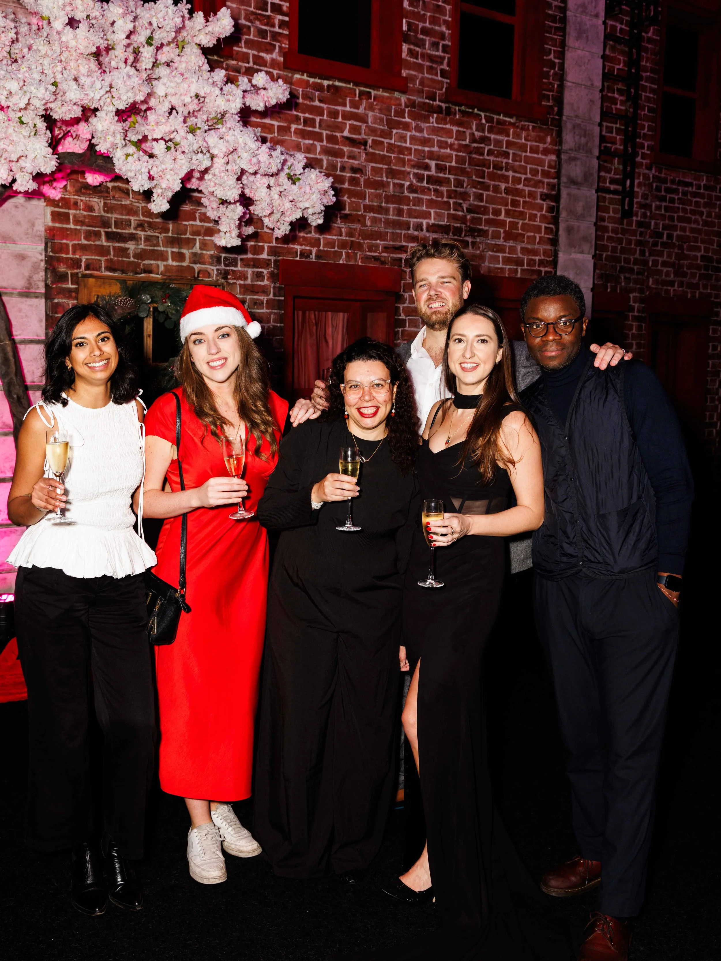 Group photo of colleagues at a Christmas party in London