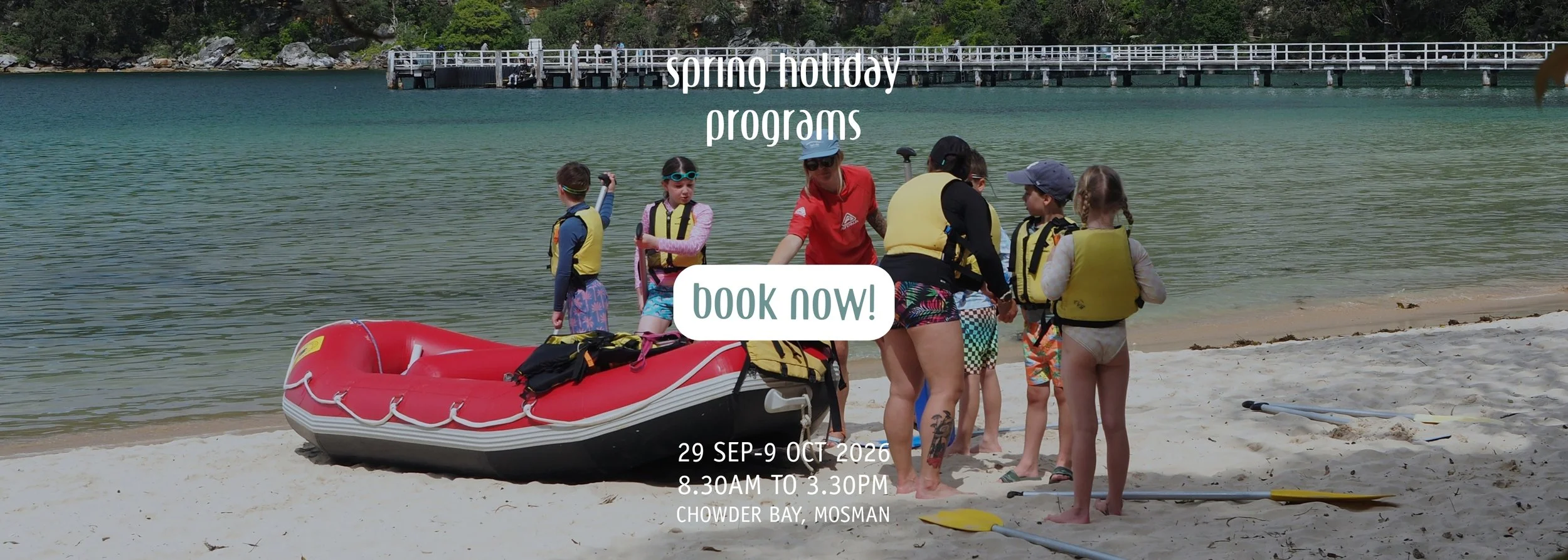 Spring school holiday programs at Saltwater School Chowder Bay from 29 September to 9 October. Photo of instructors and kids on the beach getting ready to go rafting. Book now button