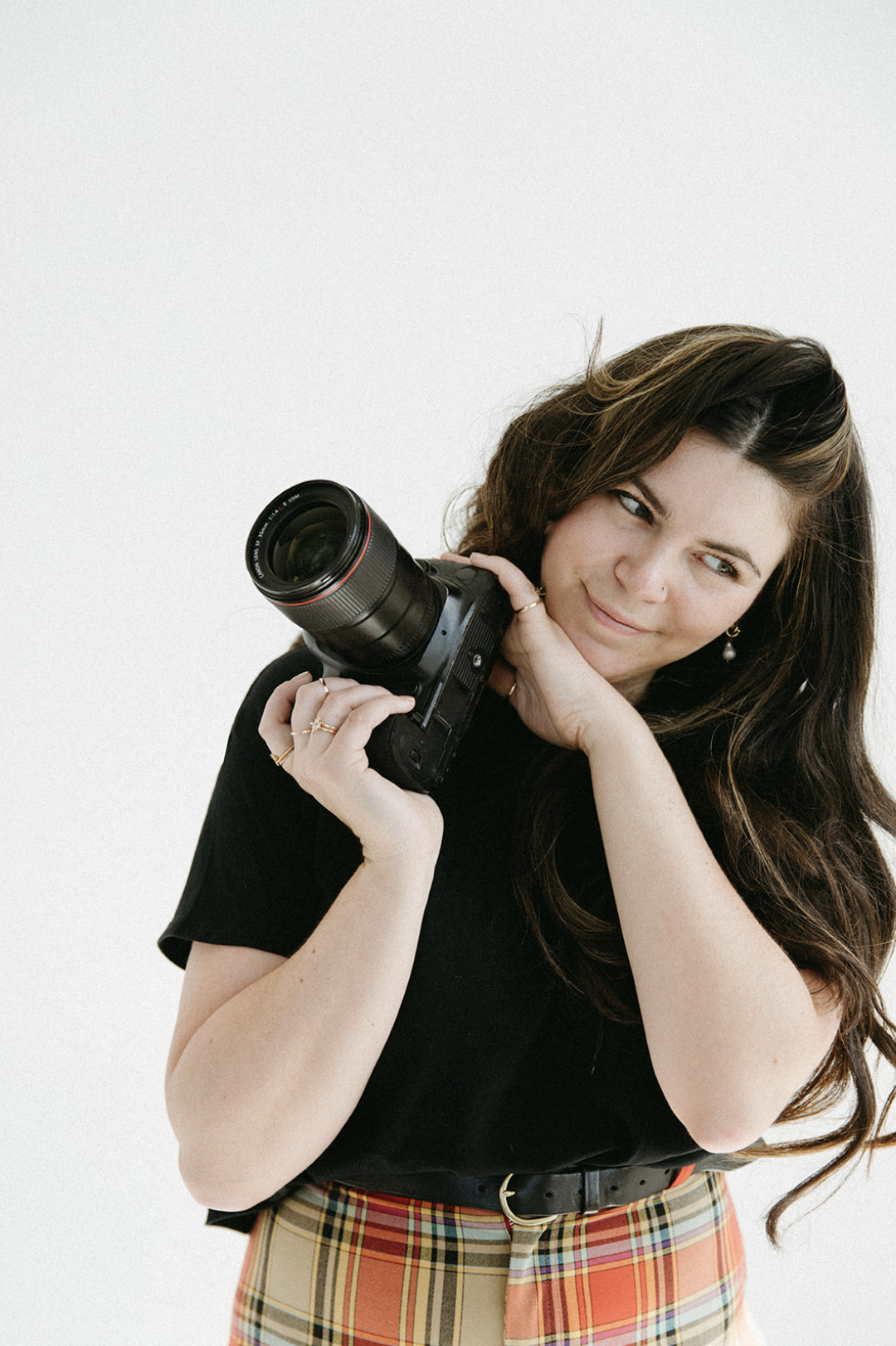 Wedding Photographer Kadi Tobin holding a camera