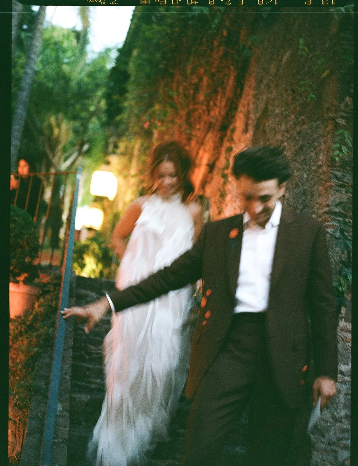 Bride and groom entering their reception at Casa Adela in San Miguel Allende