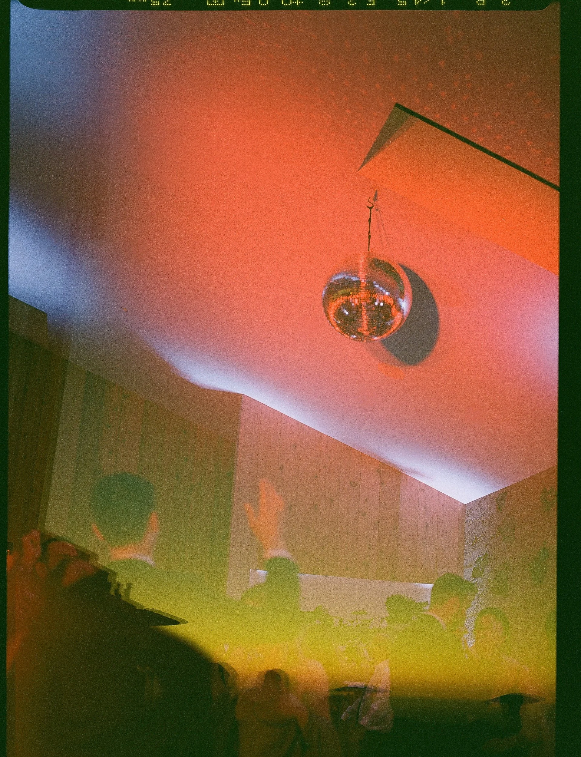 A disco Ball on a dance floor during a Sea Ranch Reception