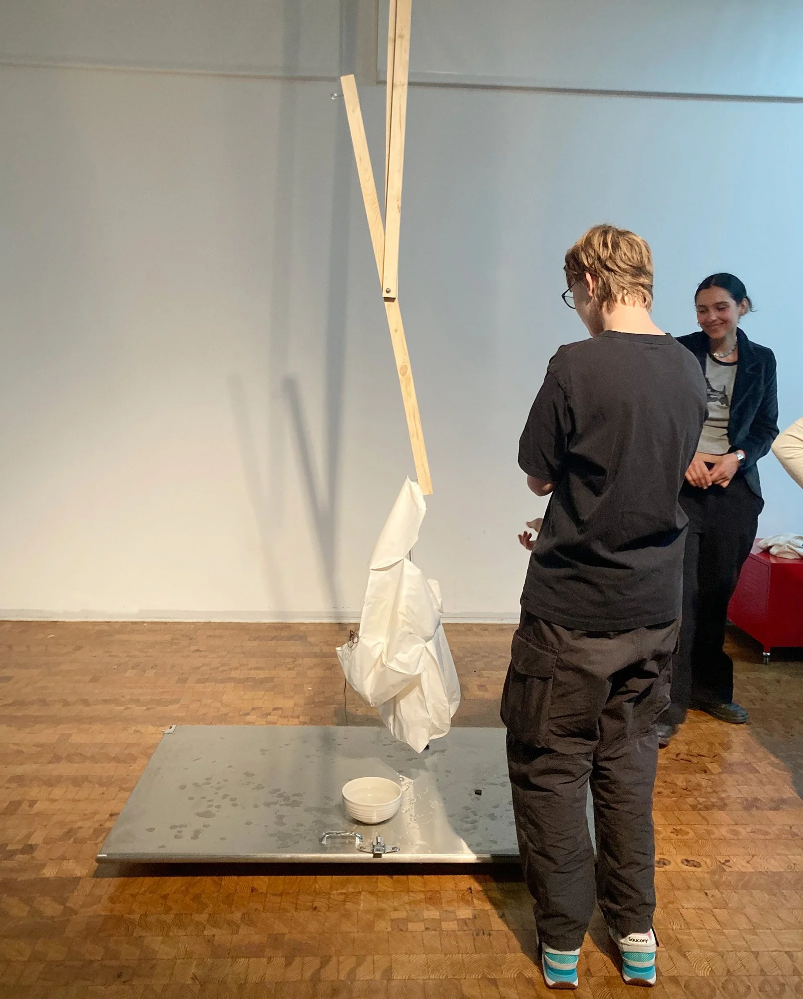 2024; Scale; Wood, stones, bathroom door, rice paper, ink, thread and water installation