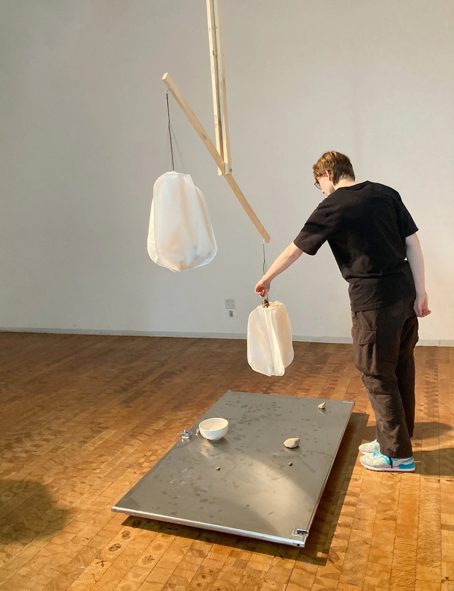 2024; Scale; Wood, stones, bathroom door, rice paper, ink, thread and water installation