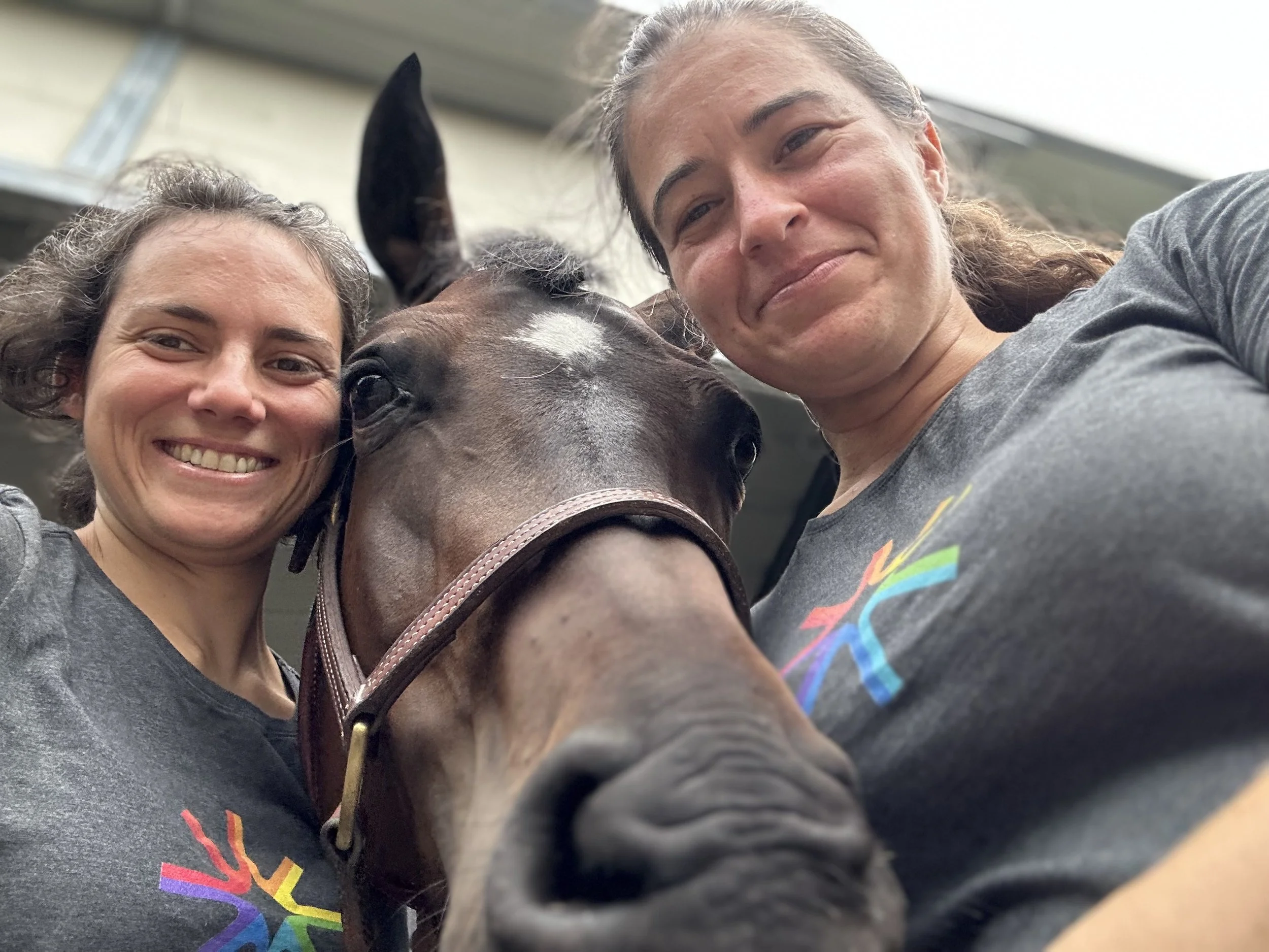Anna Jaffe (Anna Sylvan-Jaffe Waldman-Brown) and Goldi in early 2023 wearing grey Mobi.AI t-shirts 