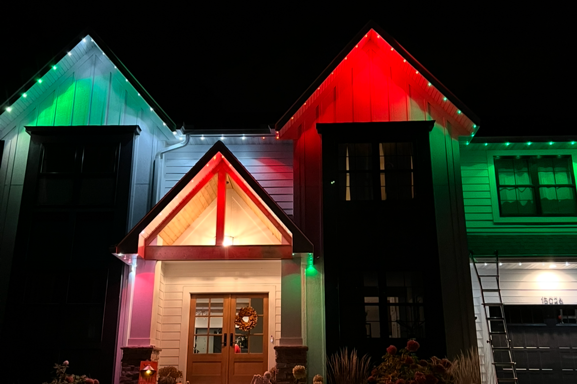 Permanent outdoor lighting on a Kansas City Missouri home with synchronized seasonal LED display