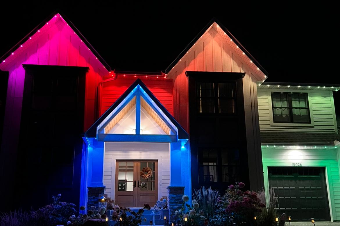 Professional LED lighting on a Minneapolis home with full roofline holiday season installation