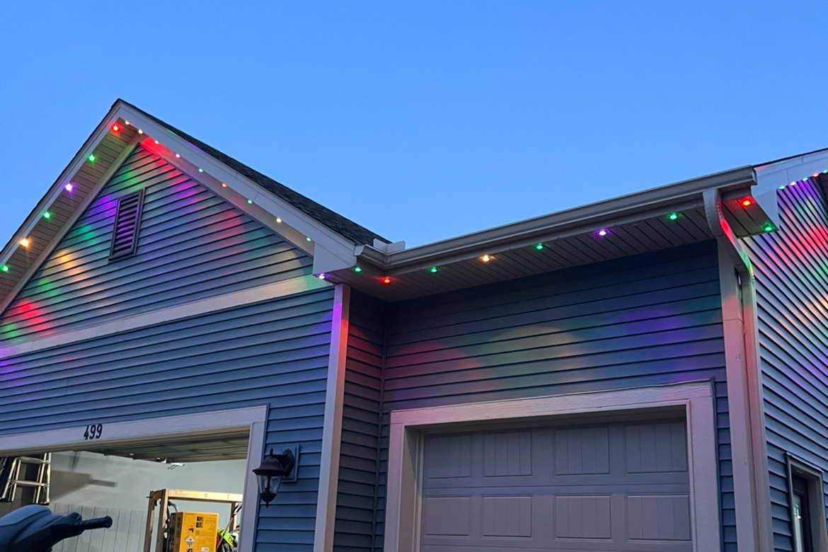 App-controlled LED lighting on a residential home set to Christmas holiday seasonal display