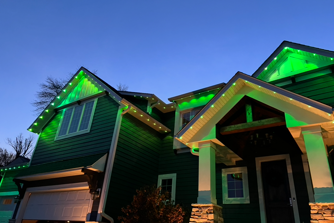 Permanent outdoor lighting on a Hudson Wisconsin home with synchronized seasonal LED display