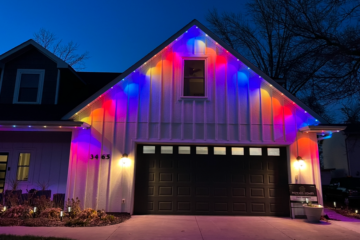 Professional permanent LED lighting install on a Bozeman home with full roofline holiday coverage