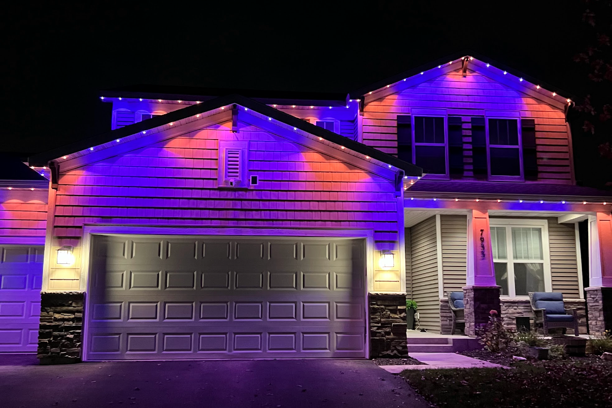 Permanent outdoor lighting on a Seattle Washington home with synchronized seasonal LED display