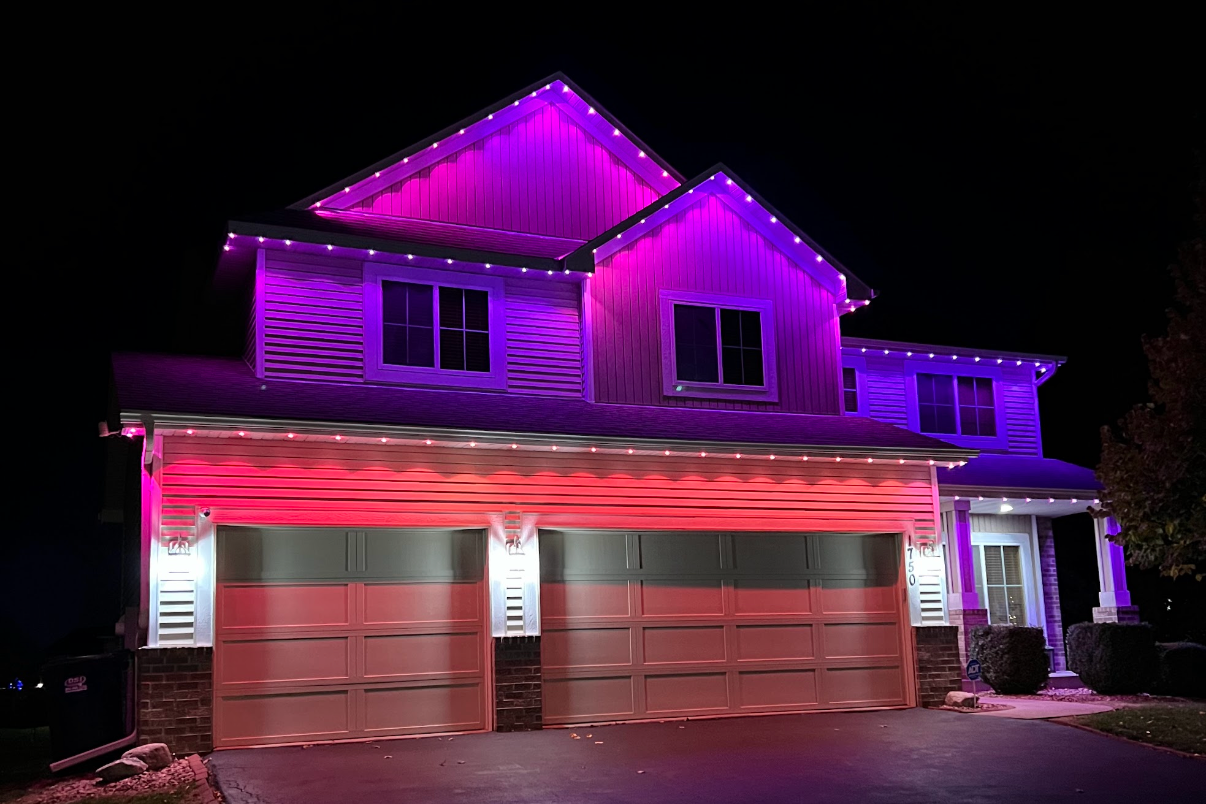 Permanent outdoor lighting on a Minneapolis Minnesota home with synchronized seasonal LED display