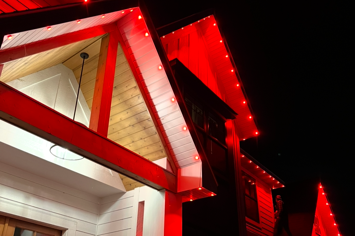 Permanent outdoor lighting on a Houston Texas home with synchronized seasonal LED display
