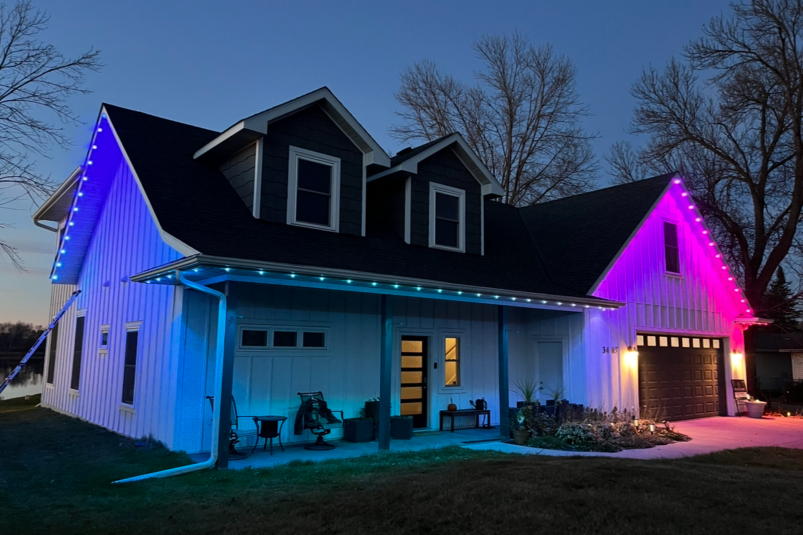 Permanent LED roofline lighting on a Hudson Wisconsin home with full soffit edge installation
