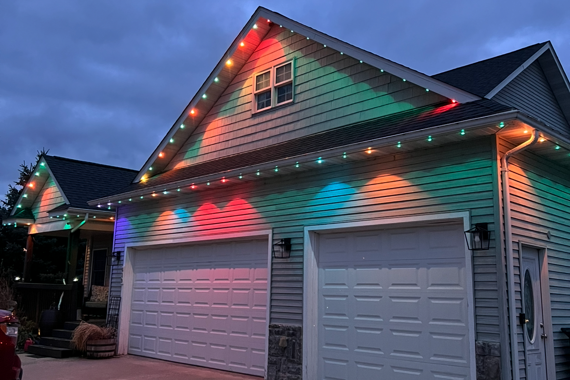 Permanent LED roofline lighting on a Kansas City Missouri home with stunning holiday seasonal display