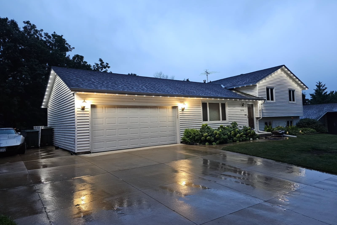 LED roofline lights on a Brooklyn Park Minnesota home glowing softly year-round