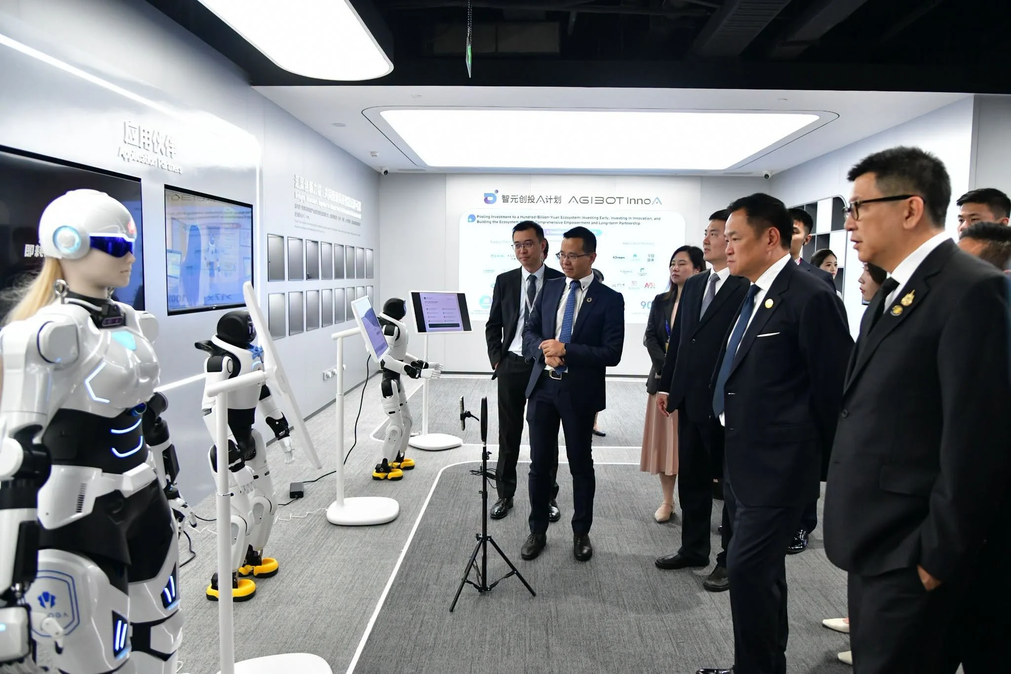 Executives visit a Chinese humanoid robotics company's showroom to view AgiBot robots