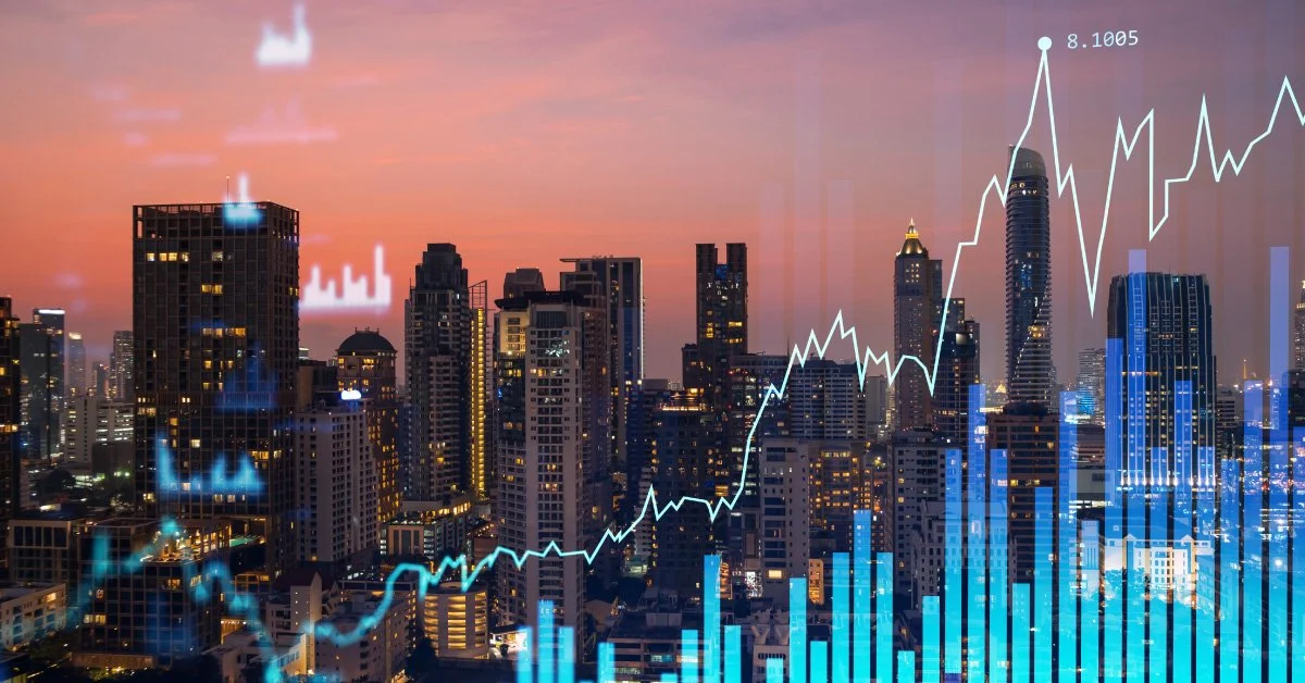 An Asian city skyline at dusk overlaid with financial growth charts, symbolizing the region's economic dynamism