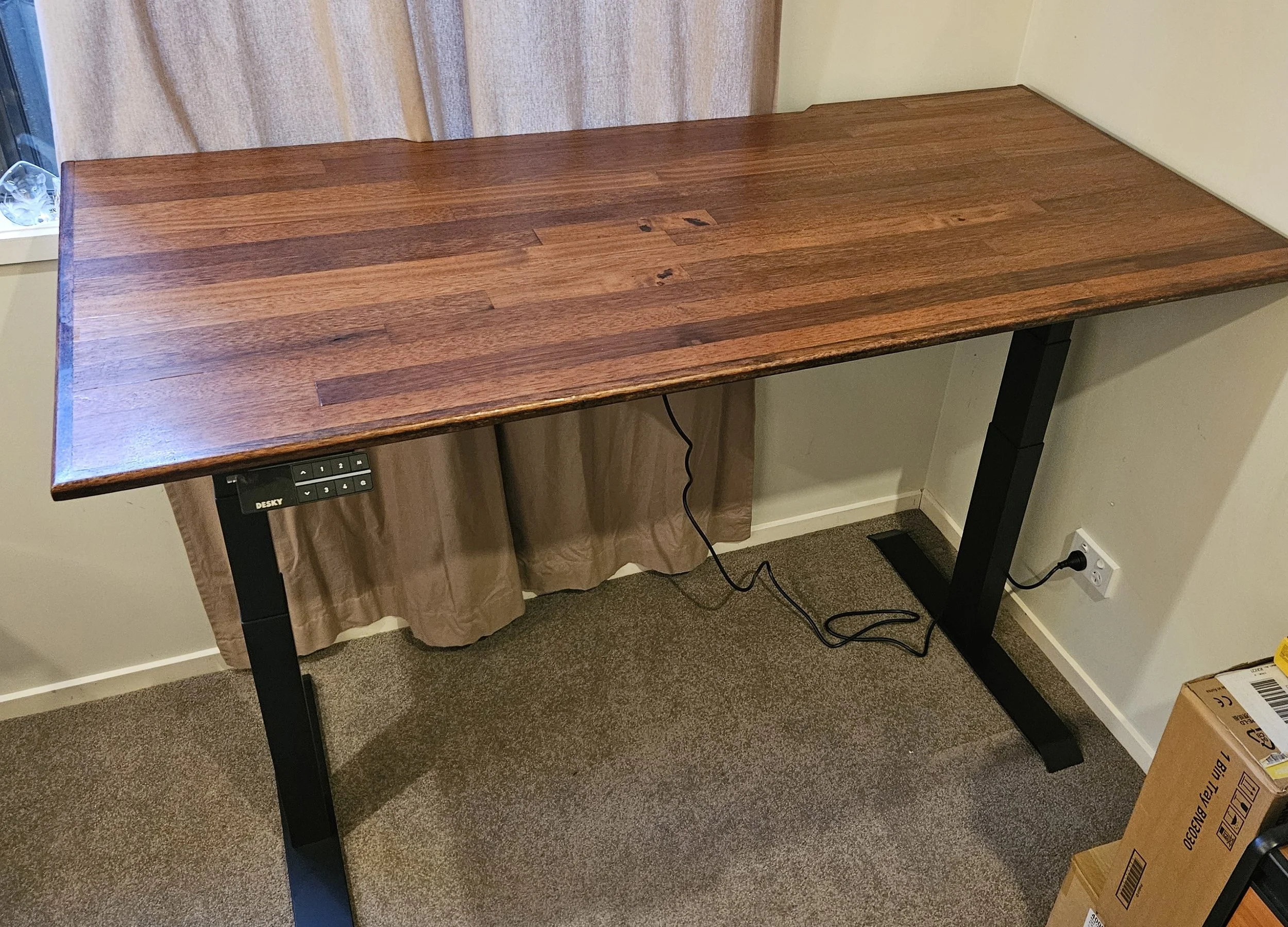 completed desk pushed into place - all varnished on sit/stand legs