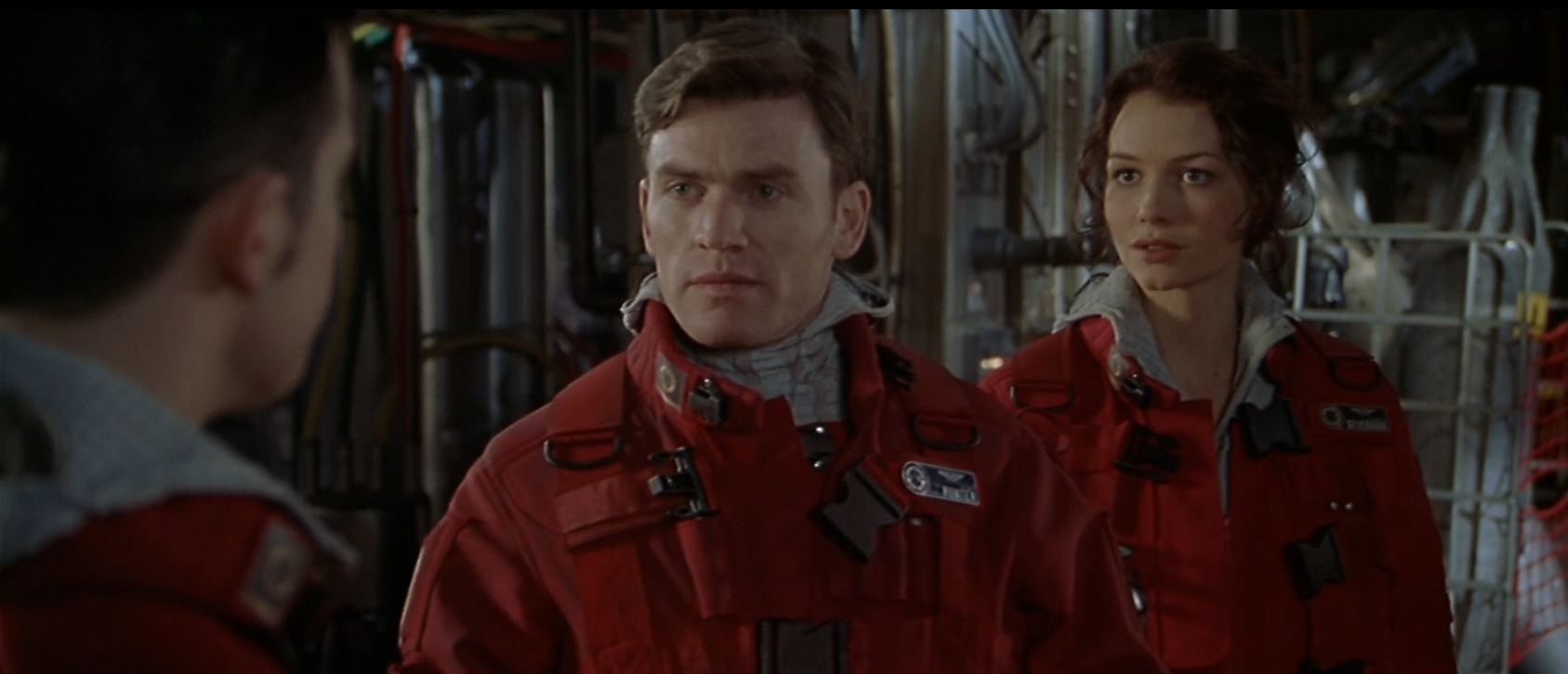 three characters discussing who will be the Wing Commander