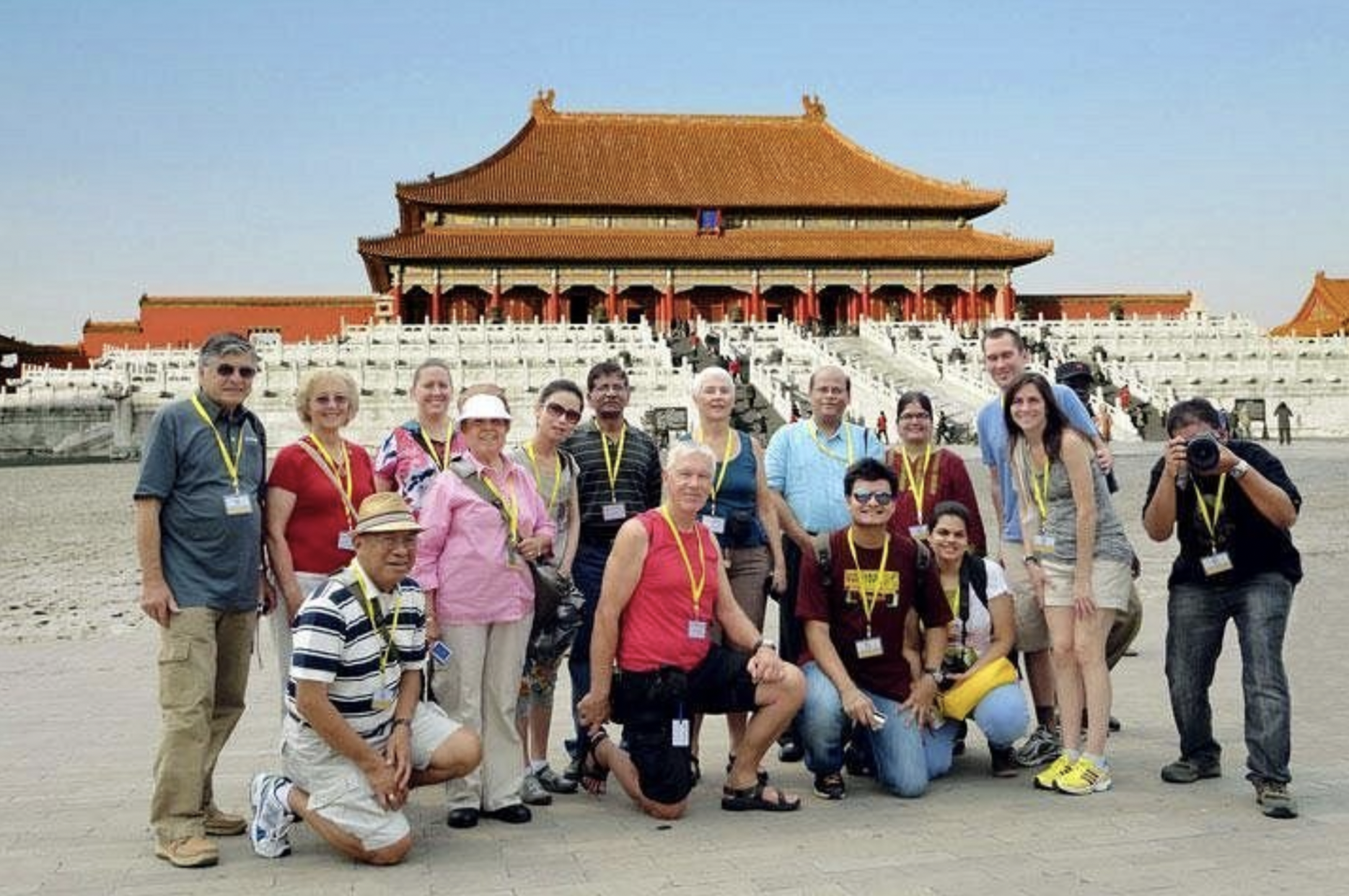 Group of travelers on a China escorted tour visiting the Great Wall.