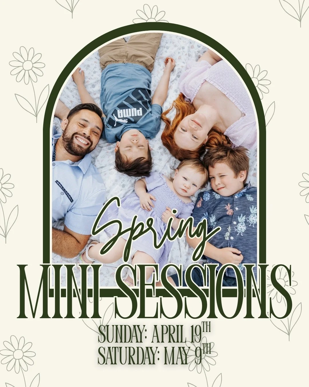 A family lying down on a blanket, smiling, during a spring mini session.