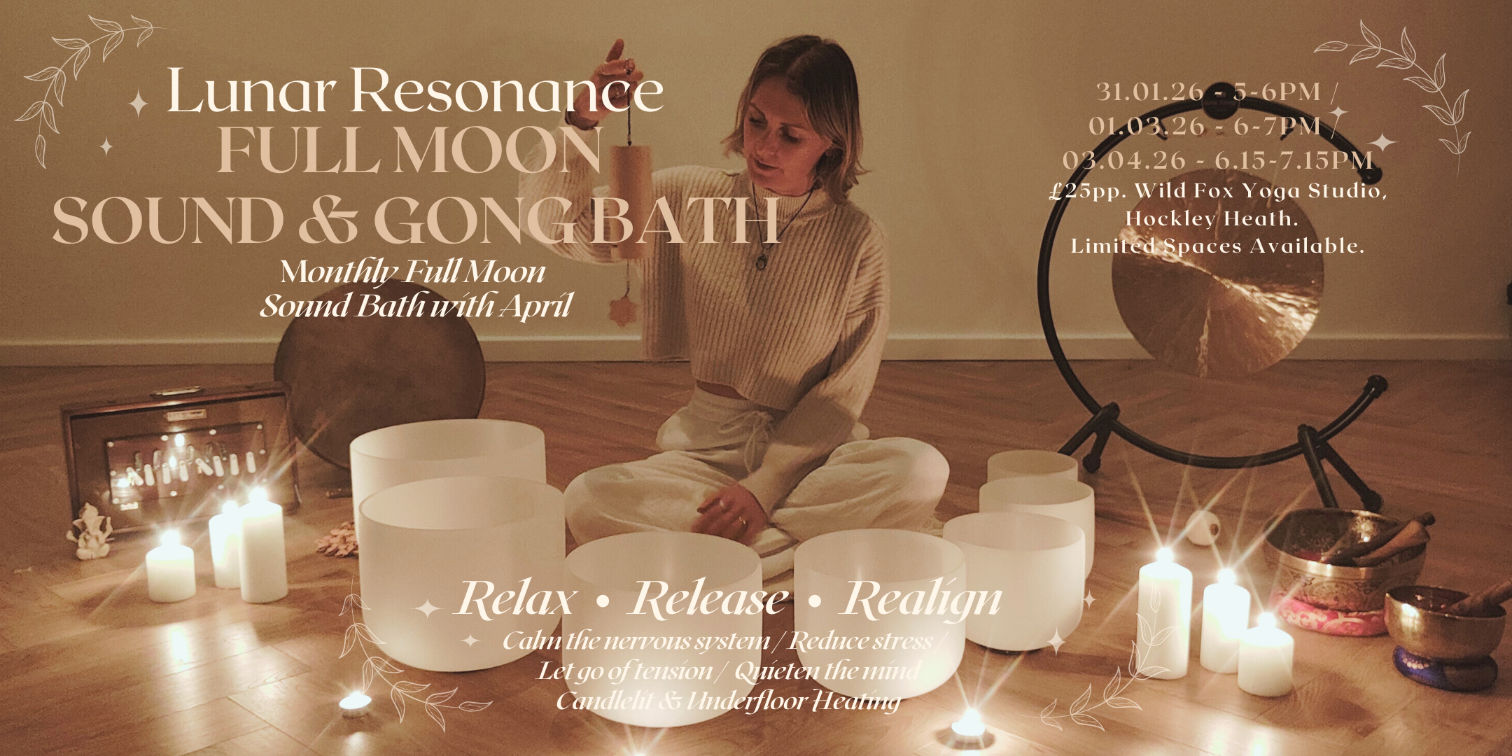 A woman sitting cross-legged on a wooden floor, surrounded by candles and singing bowls, participating in a sound bath session with a hang drum and gong in a softly lit room.