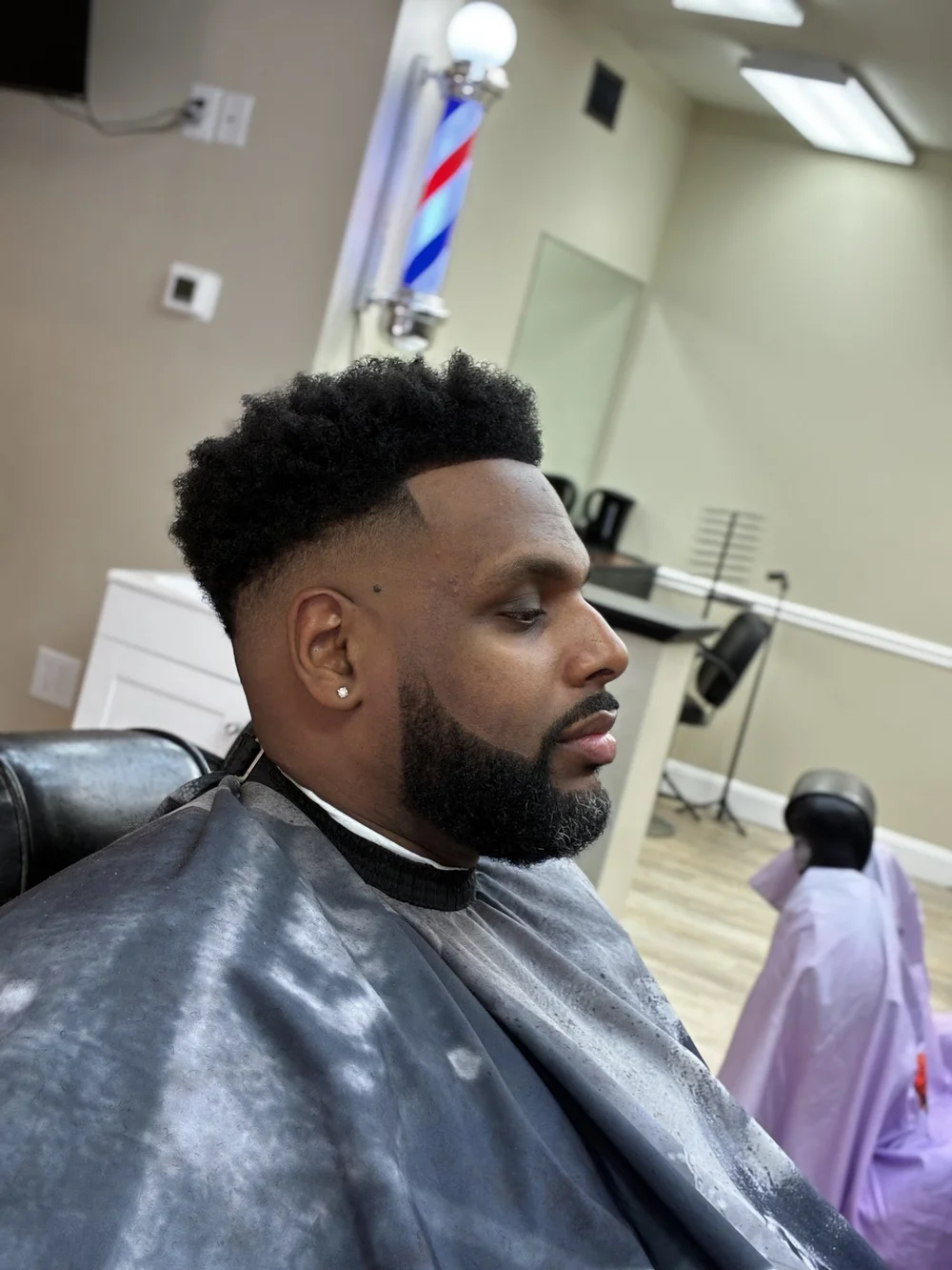 Fresh taper fade with a lined-up beard at Kingdom Touch Barbershop in Taunton