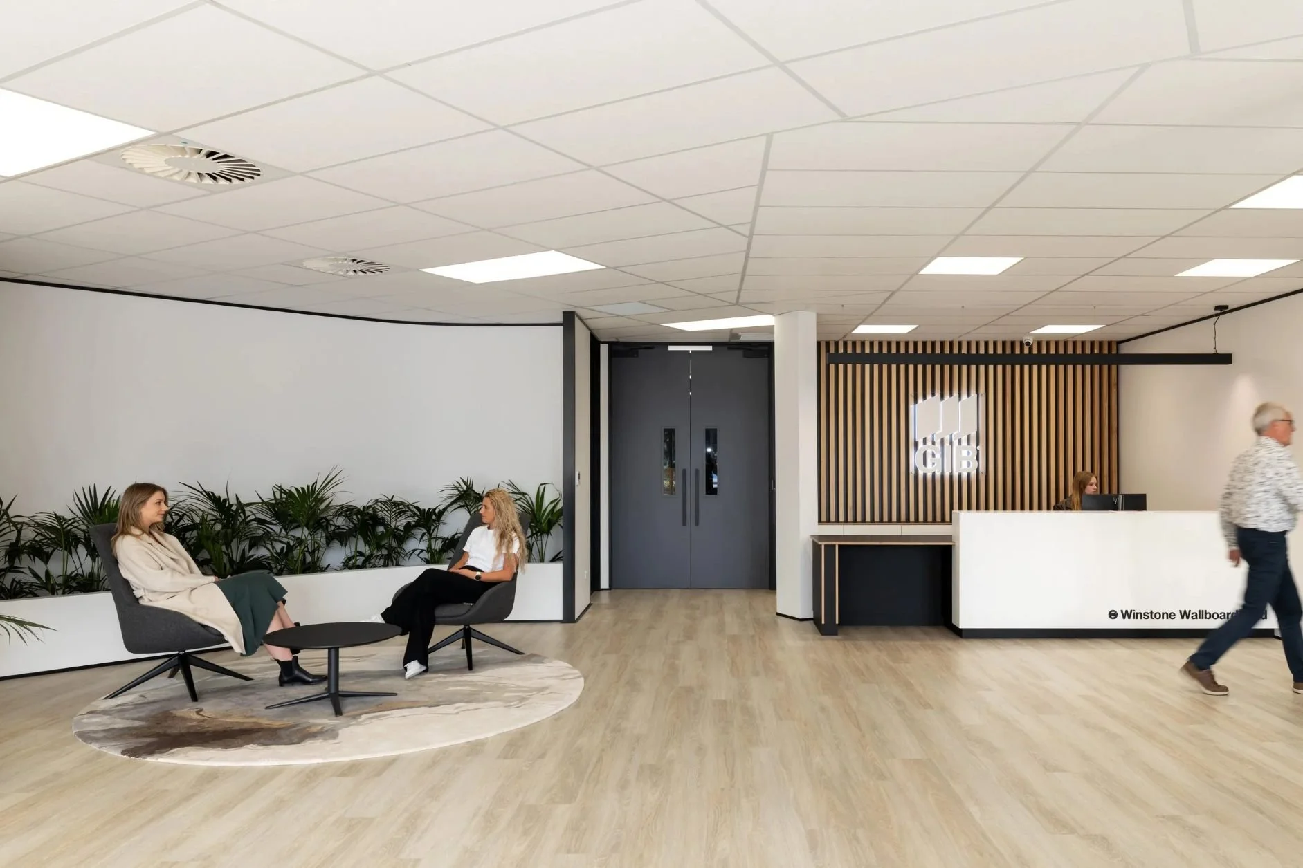 GIB Winstone reception lobby design wooden floor with visitor seating and reception counter