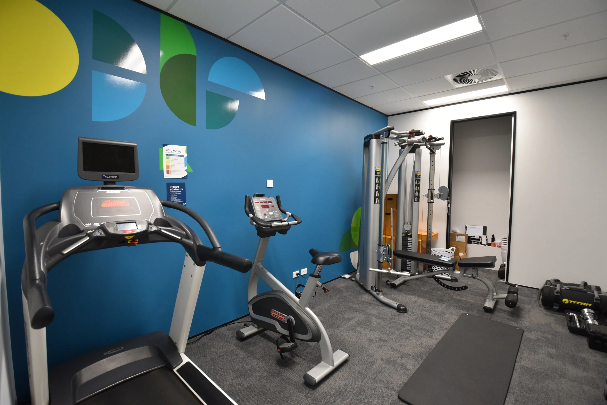 Gym equipment with blue wall
