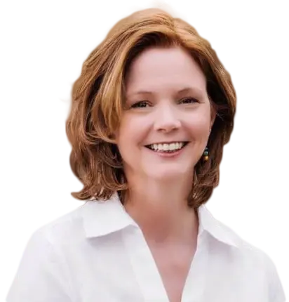 A smiling woman with shoulder-length auburn hair wearing a white collared shirt.