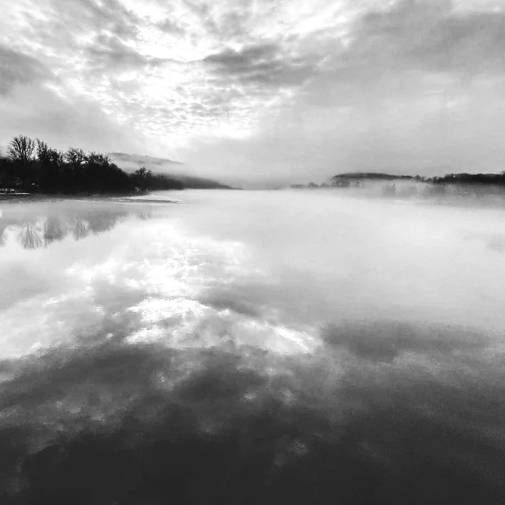 Black and white foggy river