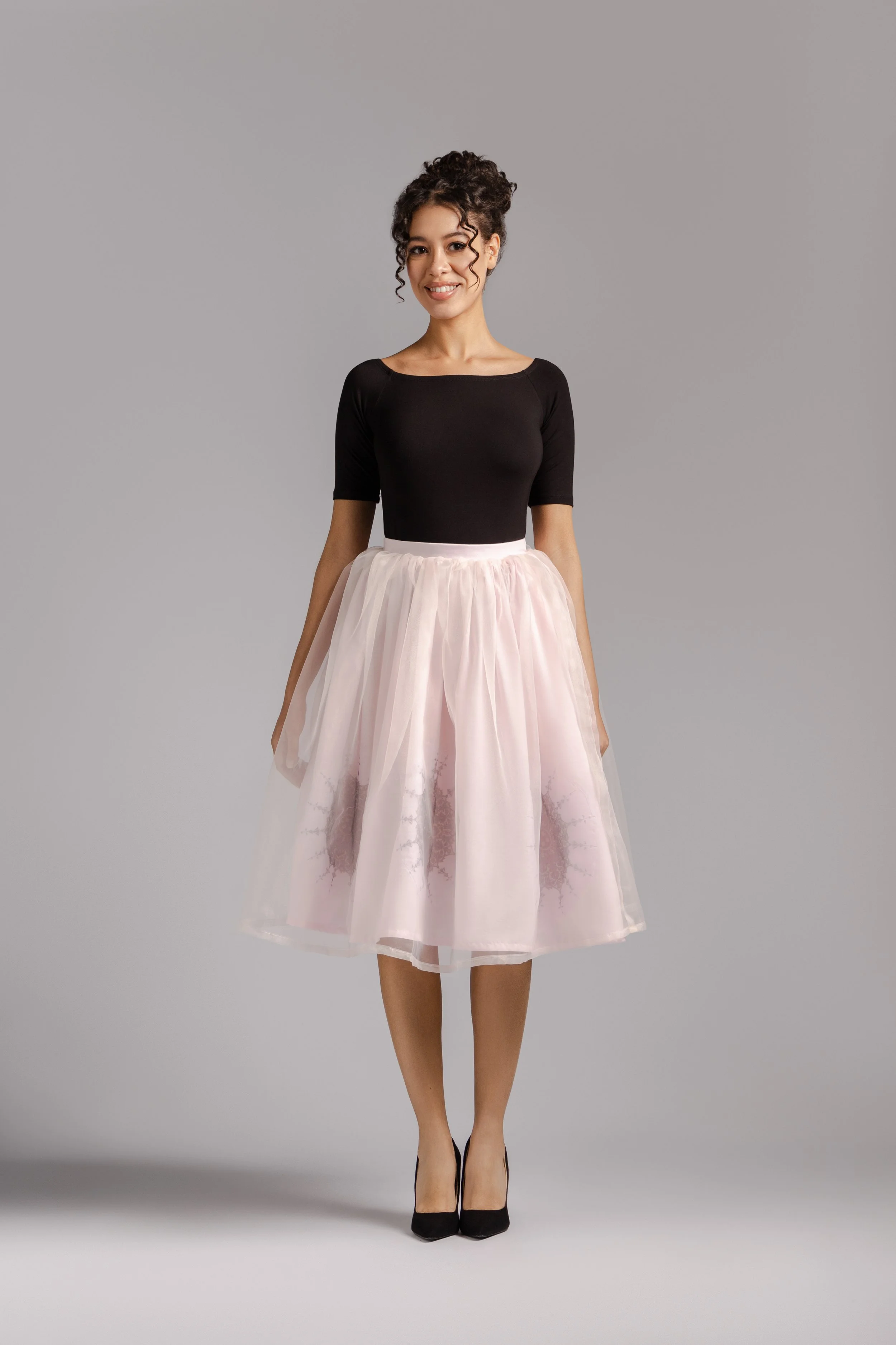 Sheer organza skirt revealing printed inner cotton layer.