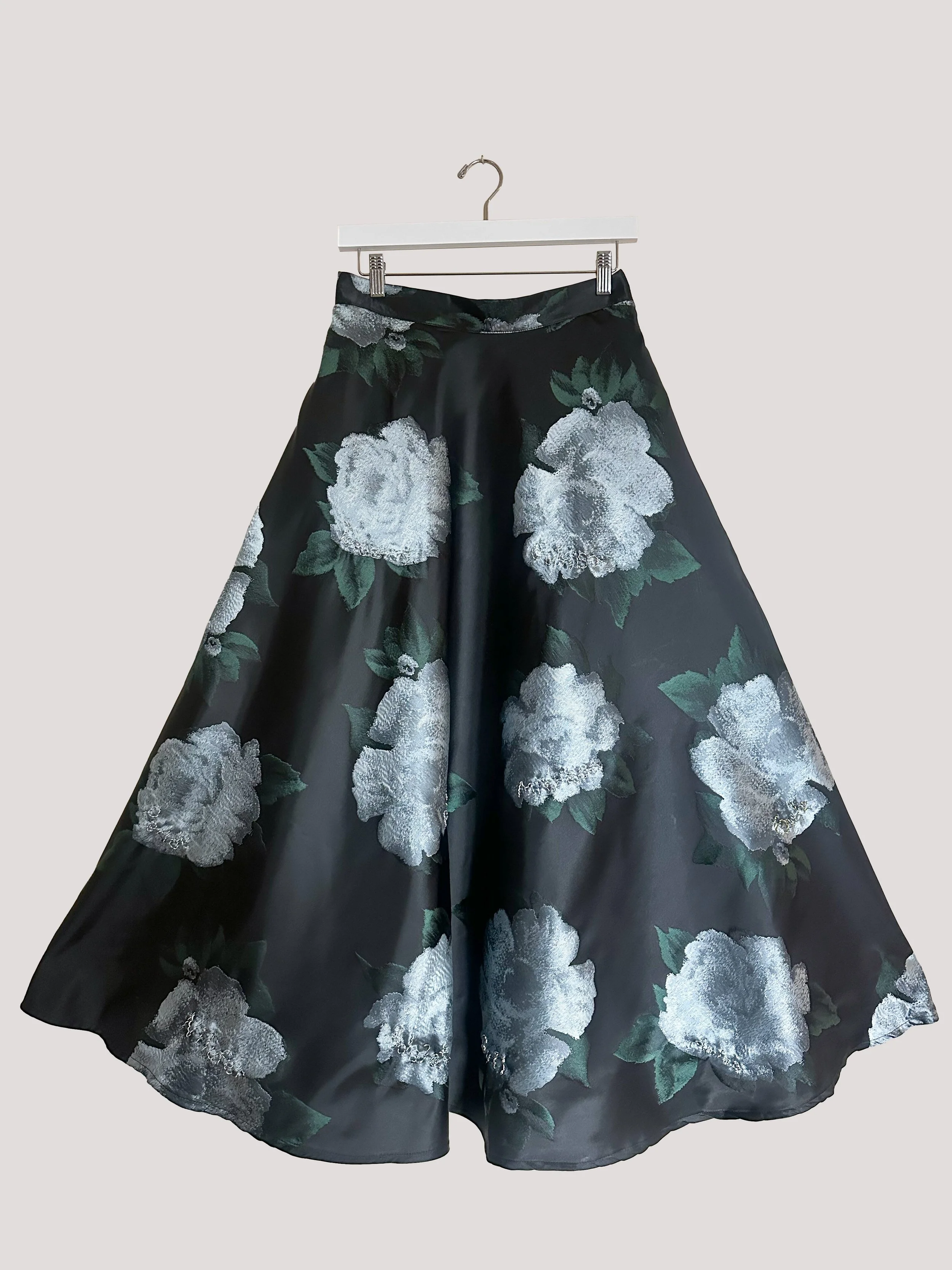 Black floral jacquard midi skirt with full 1950s-inspired silhouette.