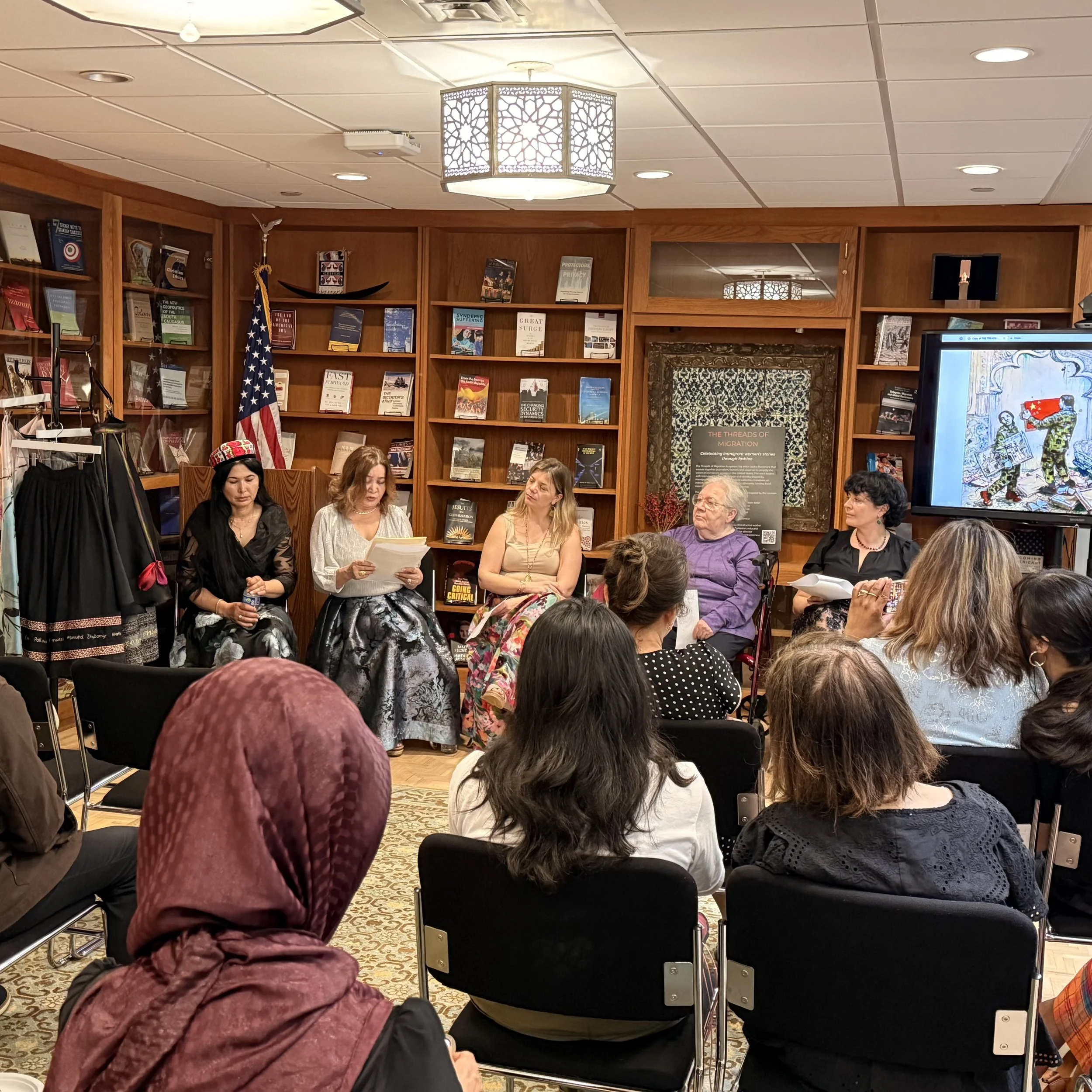 Panel discussion at Georgetown University ICC featuring Threads of Migration, with speakers sharing Jewish and Uyghur migration stories