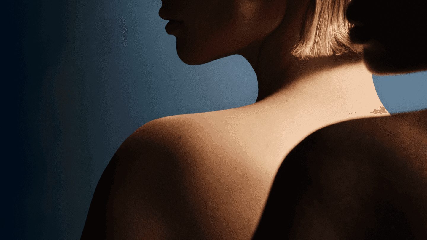 A minimal portrait bathed in soft light, expressing Puig’s refined vision of intimacy, elegance, and human connection in beauty.