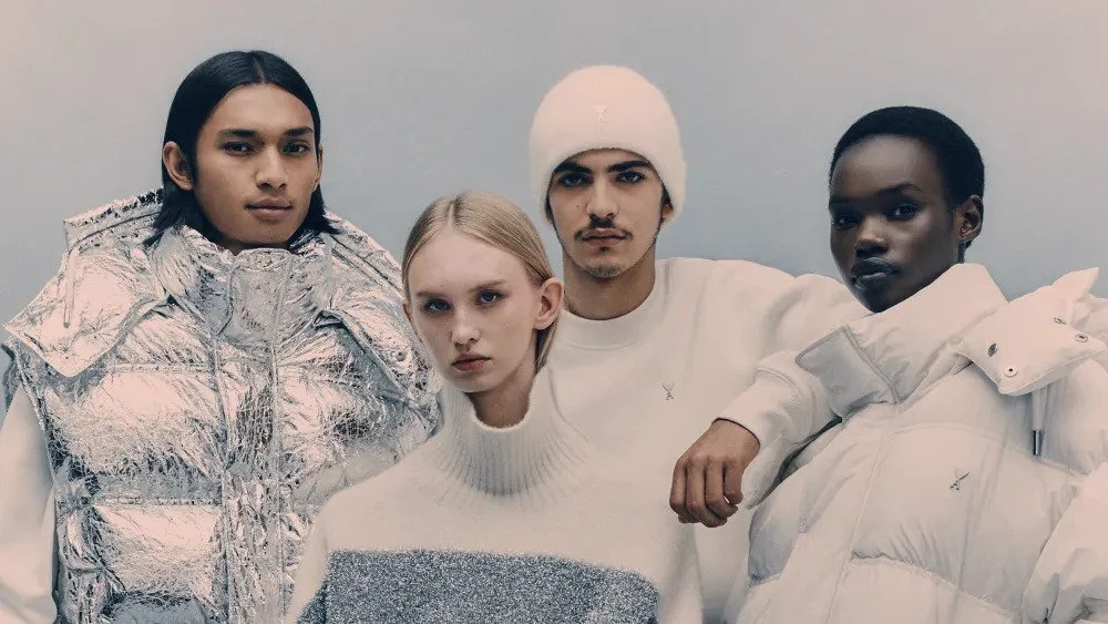 AMI Paris Fall Winter campaign showcasing minimalist silhouettes and modern outerwear styled on a group of models in neutral tones