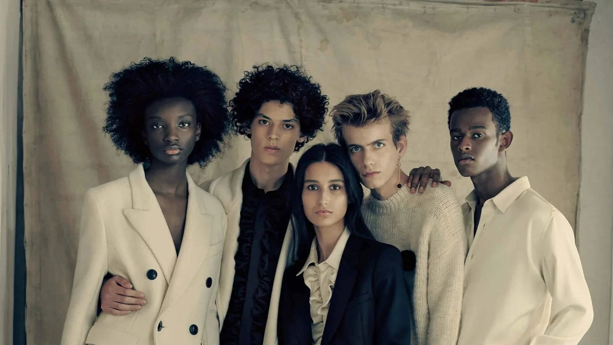 AMI Paris campaign portrait featuring diverse models wearing neutral tailored pieces reflecting the brand’s modern and inclusive vision of Parisian style