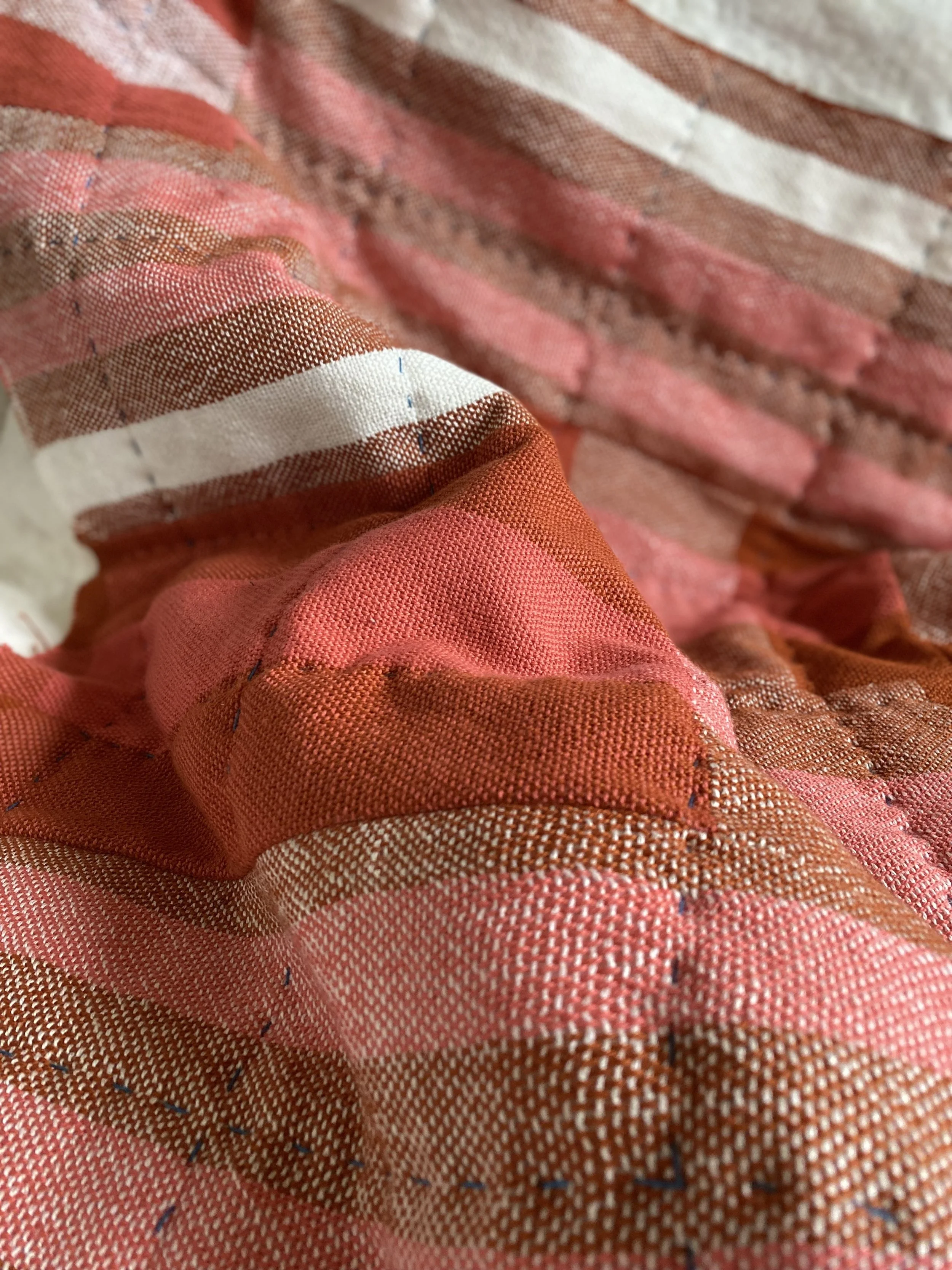 Happier Than (detail), 2024, handwoven cotton and linen top, linen back, handstitched with sashiko thread 