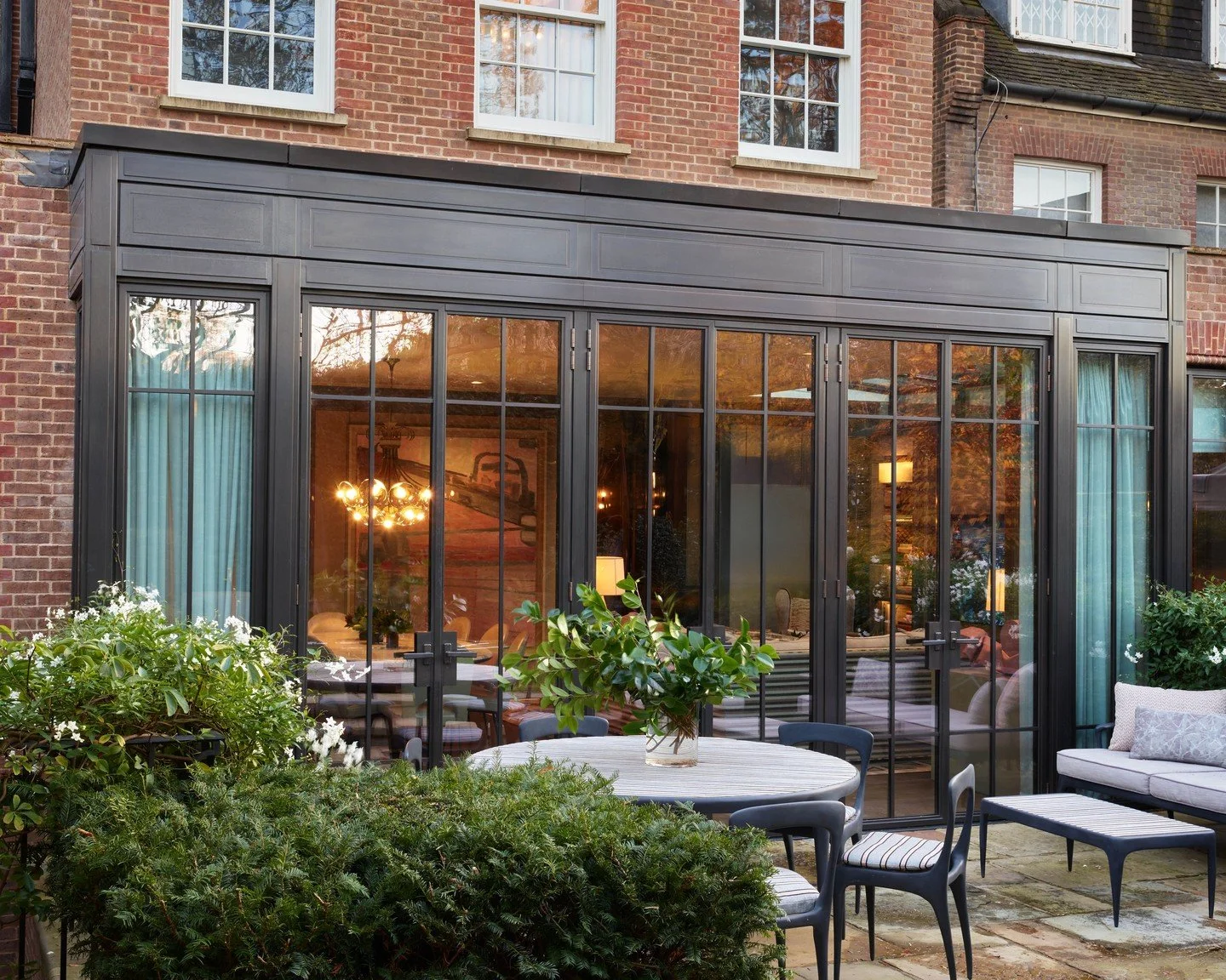 Brick, bronze, and planting.
A considered London addition.