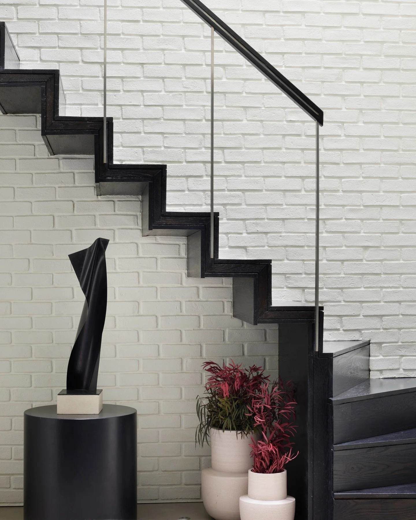 The stair turns like a folded line.
A quiet sculpture, set beneath. 

_
@cadogangallery